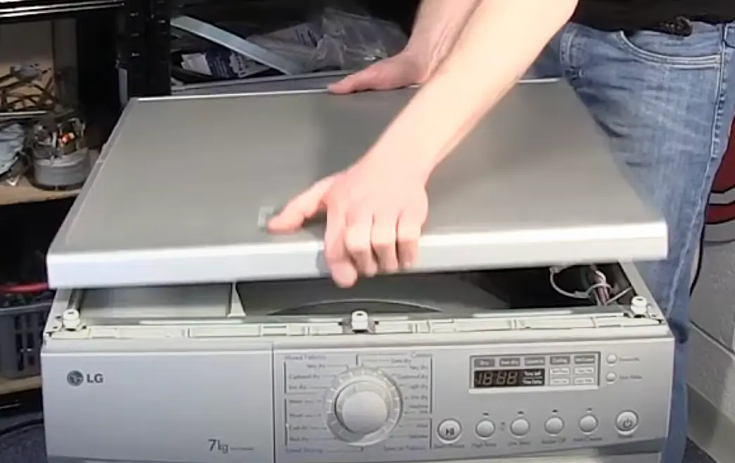 Image of removing top panel of the dryer