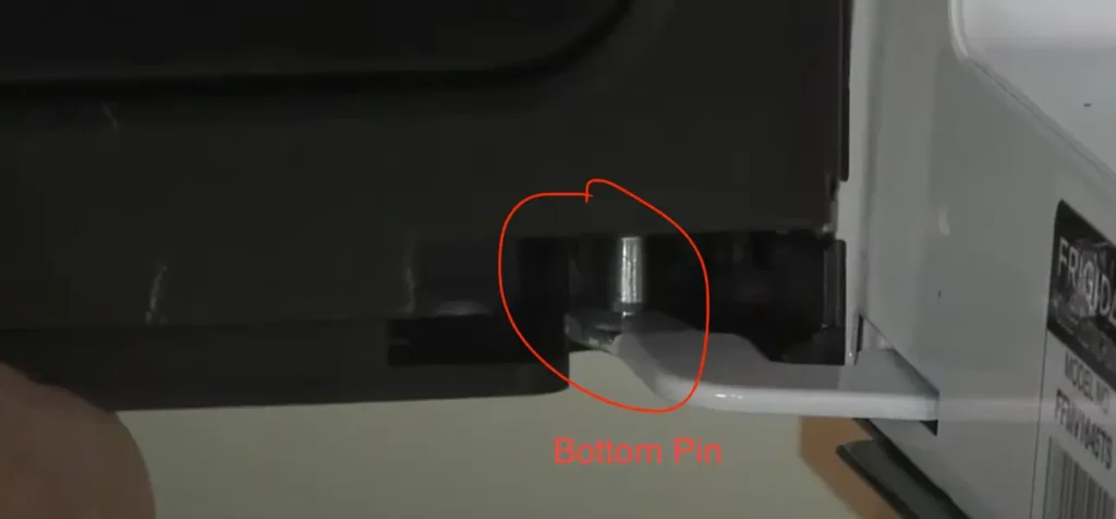 Image of fitting microwave door on bootom side